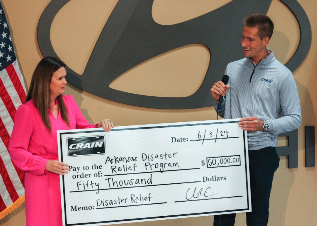 Crain Automotive Team presents a $50,000 donation check to Arkansas Disaster Relief Program